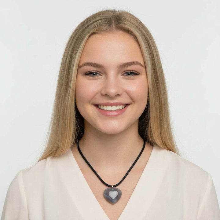 Grey banded agate carved heart pendant.