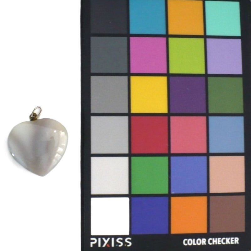 Grey banded agate carved heart pendant next to color coded card.
