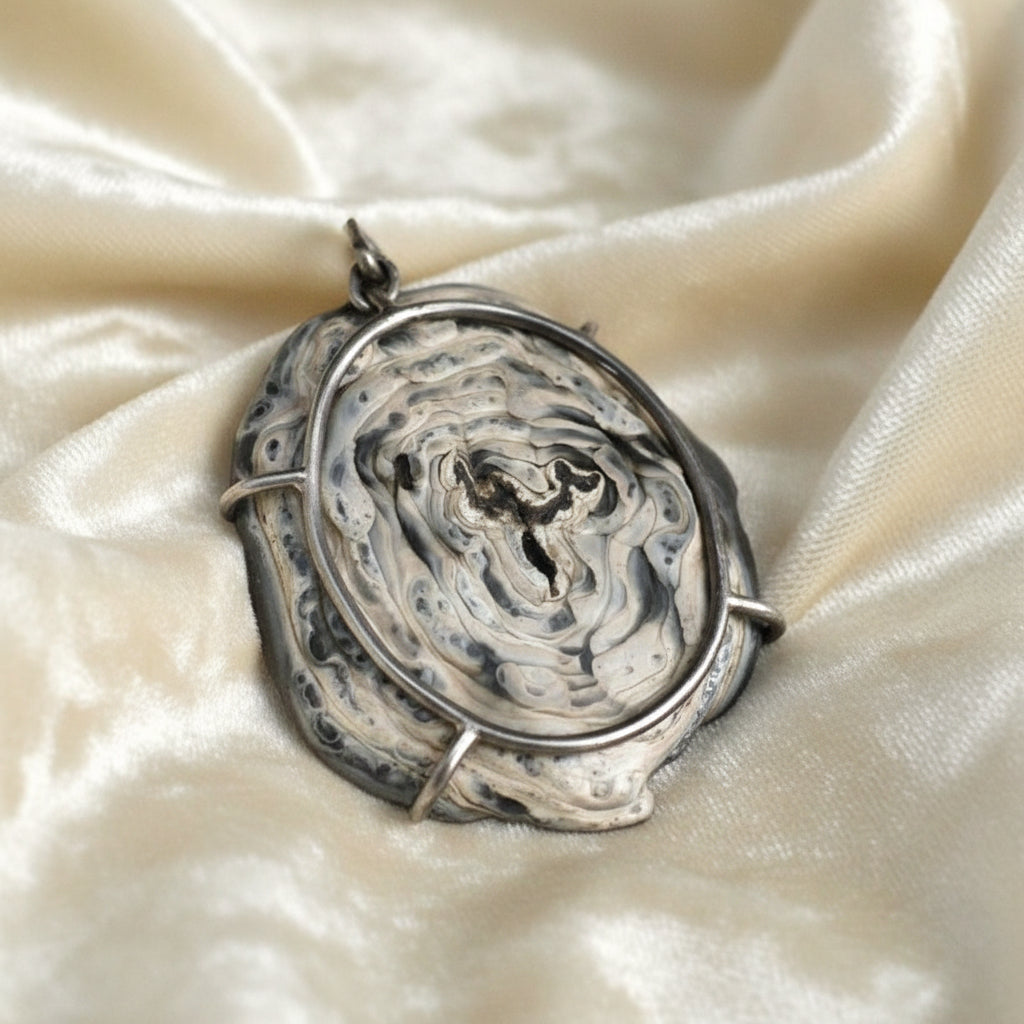  Back side of 1960s Chalcedony Rose Druzy Pendant on a velvet background.