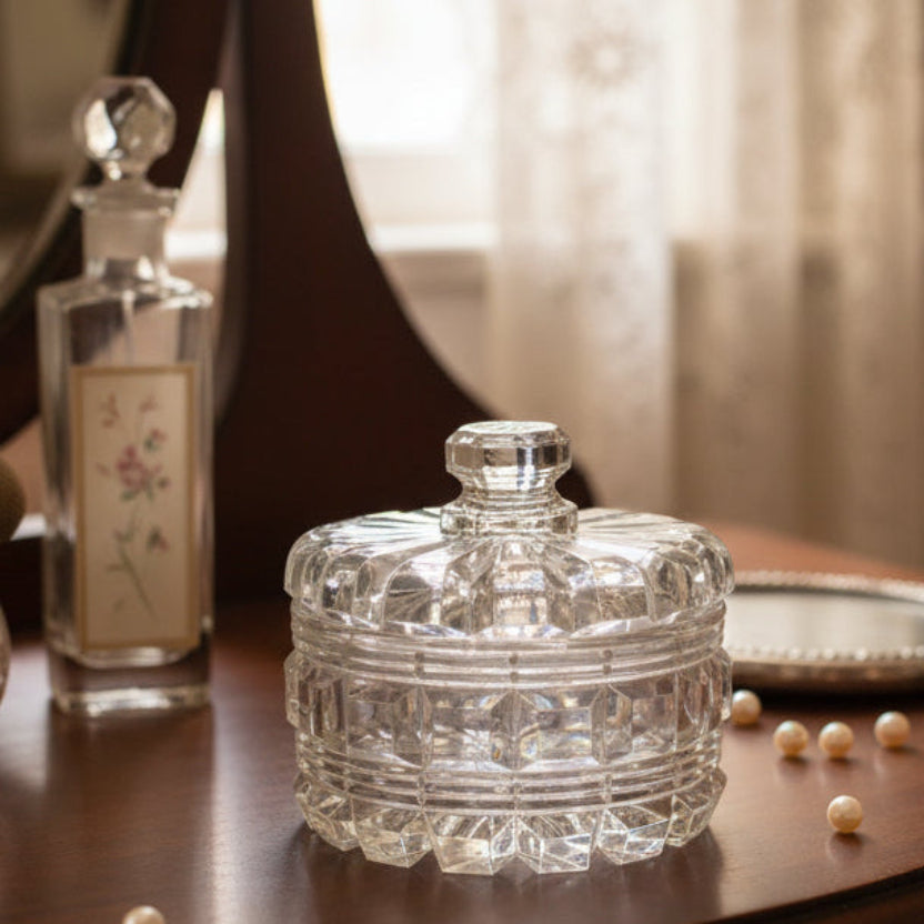 Vintage Pressed Glass Vanity Powder Box w/ Lid 1940s–50s Mid-Century Clear Lead Crystal Trinket Dish Jar on a wooden surface with a blurred background.