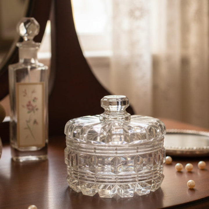 Vintage Pressed Glass Vanity Powder Box w/ Lid 1940s–50s Mid-Century Clear Lead Crystal Trinket Dish Jar on a wooden surface with a blurred background.