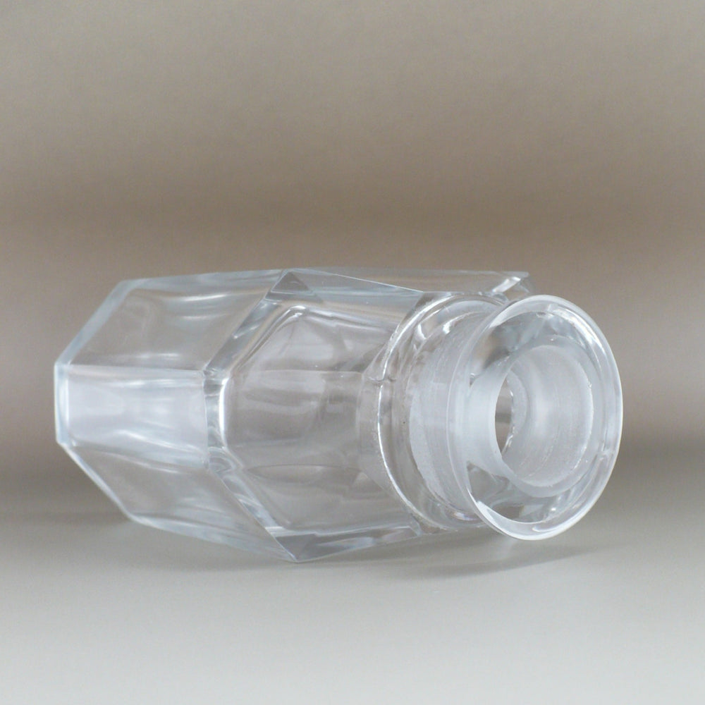 Cristalleries de Nancy Art Deco Crystal Perfume Bottle, laying on side at three quarter angle, showing close-up of mouth and shoulder.