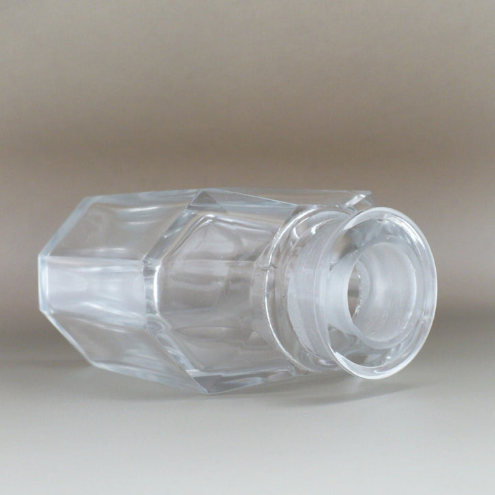 Cristalleries de Nancy Art Deco Crystal Perfume Bottle, laying on side at three quarter angle, showing close-up of mouth and shoulder.