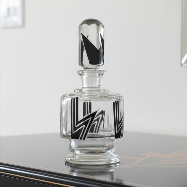 1930s Art Deco Palda Cologne or Perfume Decanter on a reflective surface