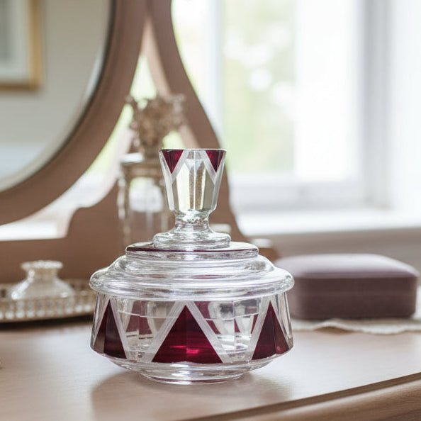 1930s Red Palda Vanity Powder Box on a surface, with a mirror and window in the background.