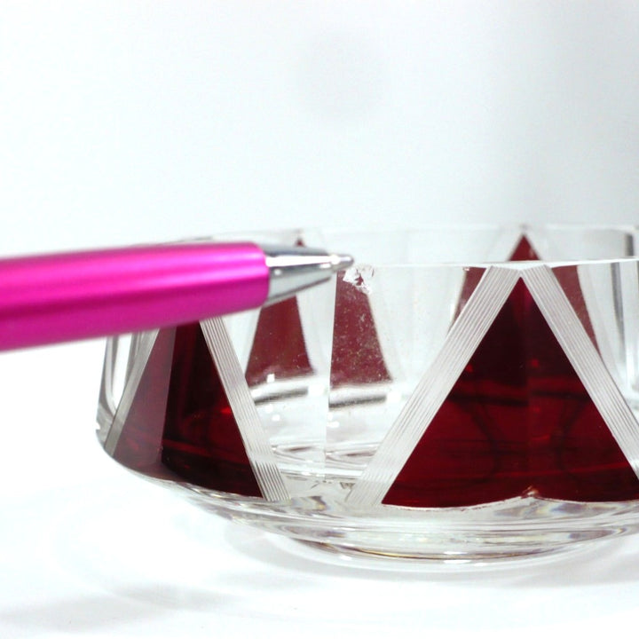 Close-up view highlighting the minor edge chip on the base of the Karl Palda powder bowl for transparent condition disclosure. 