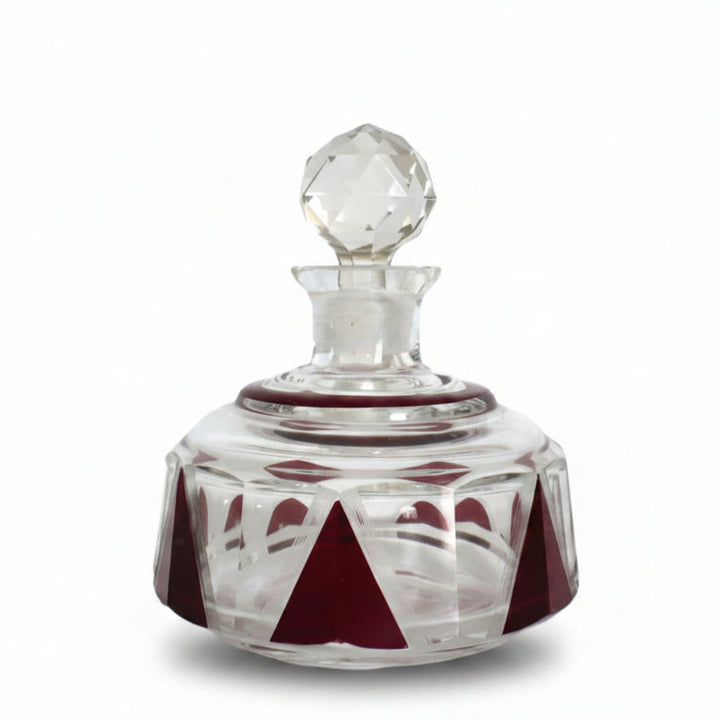 Karl Palda small crystal perfume decanter with a replacement stopper and red geometric enameled panels.