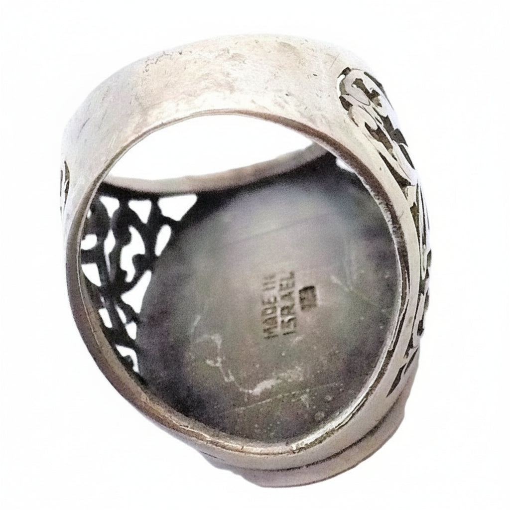 Ring shows Made In Israel and 925 sterling silver hallmarks.