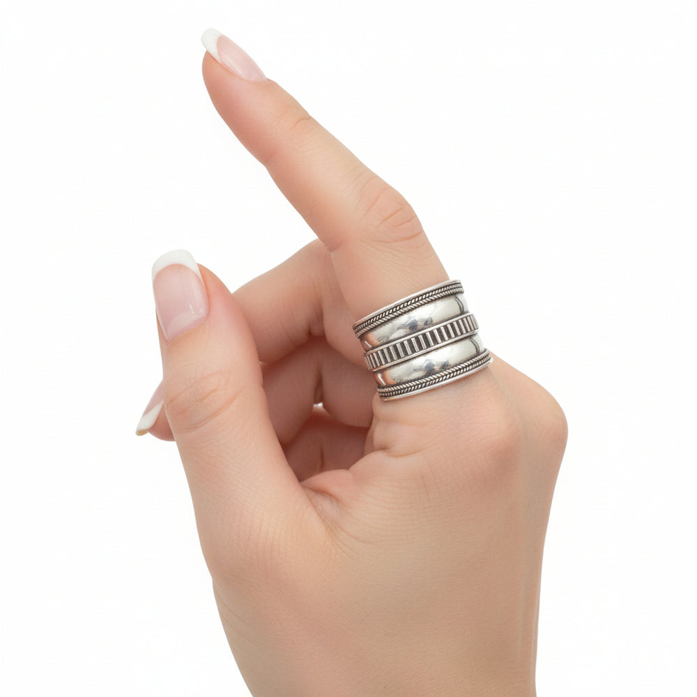 Vintage 1980s Roman-Inspired Sterling Silver Thumb Ring shown on finger.