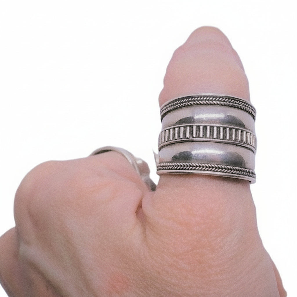 Vintage 1980s Roman-Inspired Sterling Silver Thumb Ring on thumb.