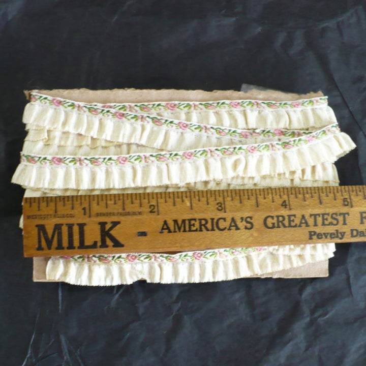 Vintage sewing trim.\ length next to ruler to show scale.