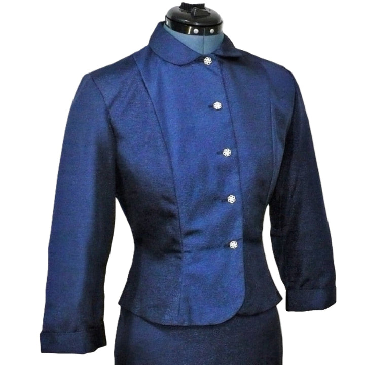 1950s Vintage Smart-fitting Navy Blue Skirt Suit on a dress form.