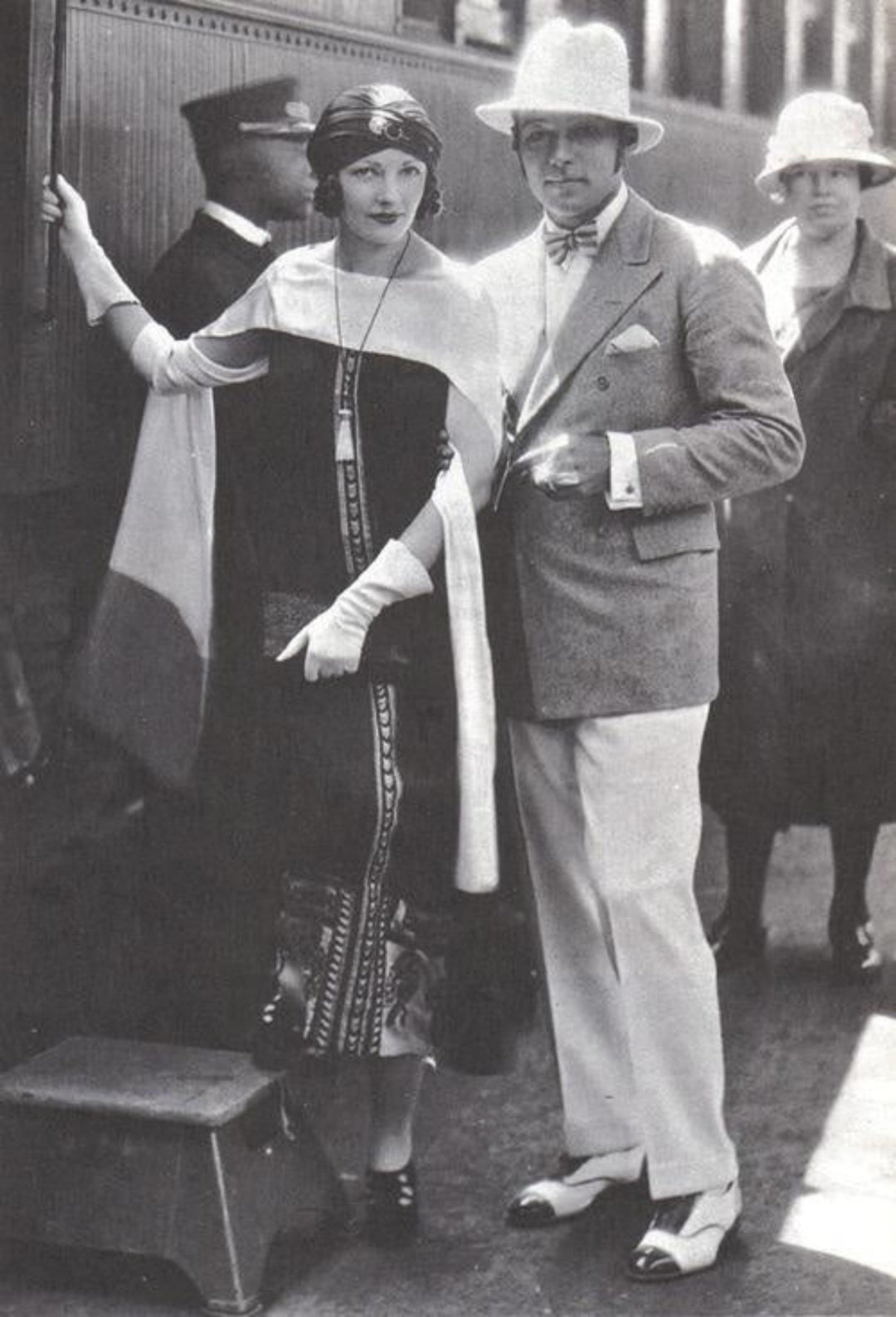 Rudolph Valentino wife wearing scarf.