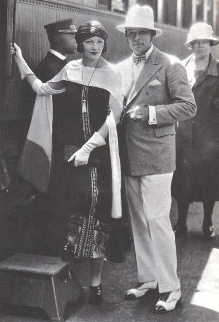 Rudolph Valentino wife wearing scarf.