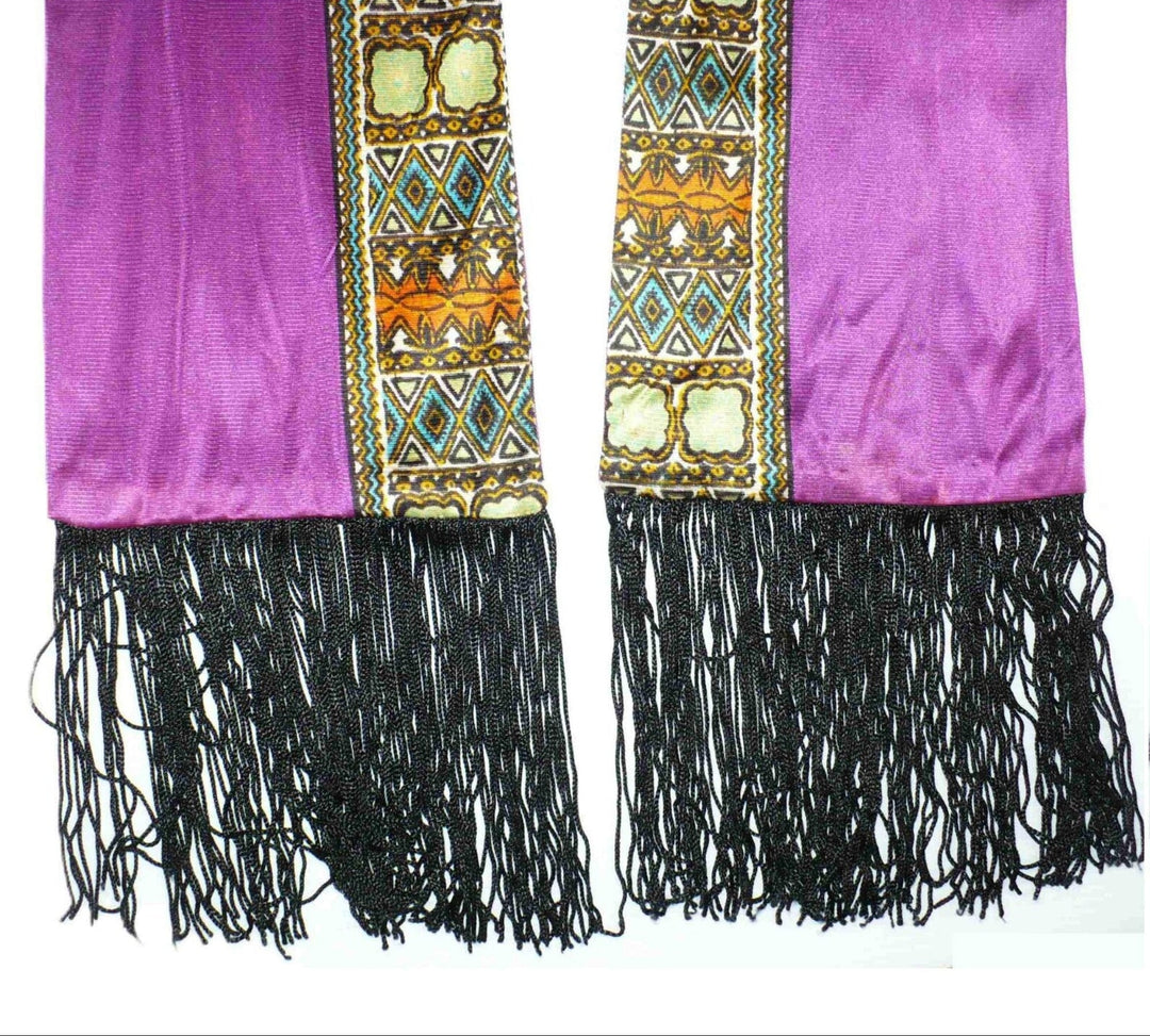 Detail of fringe on 1920s Vintage Long Silk Jersey Knit Bohemian Gypsy Scarf or Sash on white background.