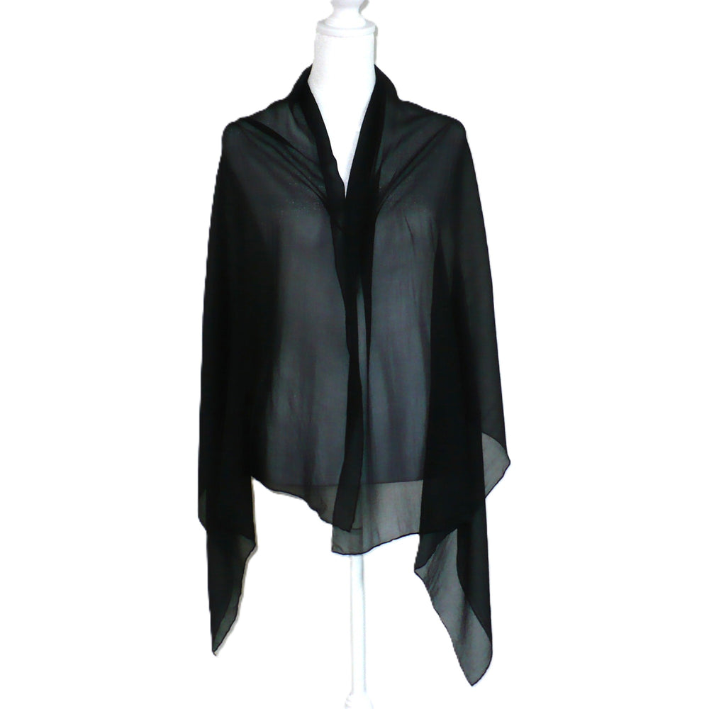 Black scarf on a mannequin against a white background.