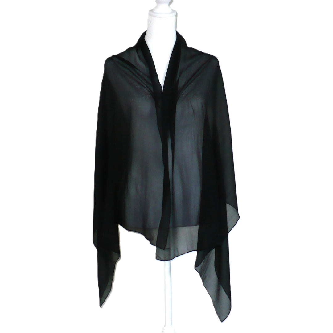 Black scarf on a mannequin against a white background.