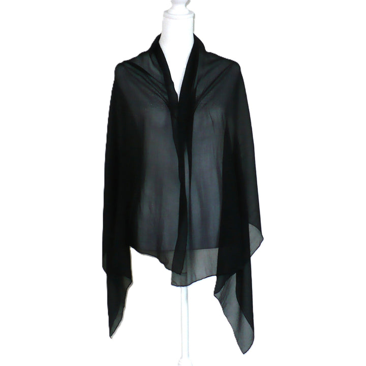 Black scarf on a mannequin against a white background.