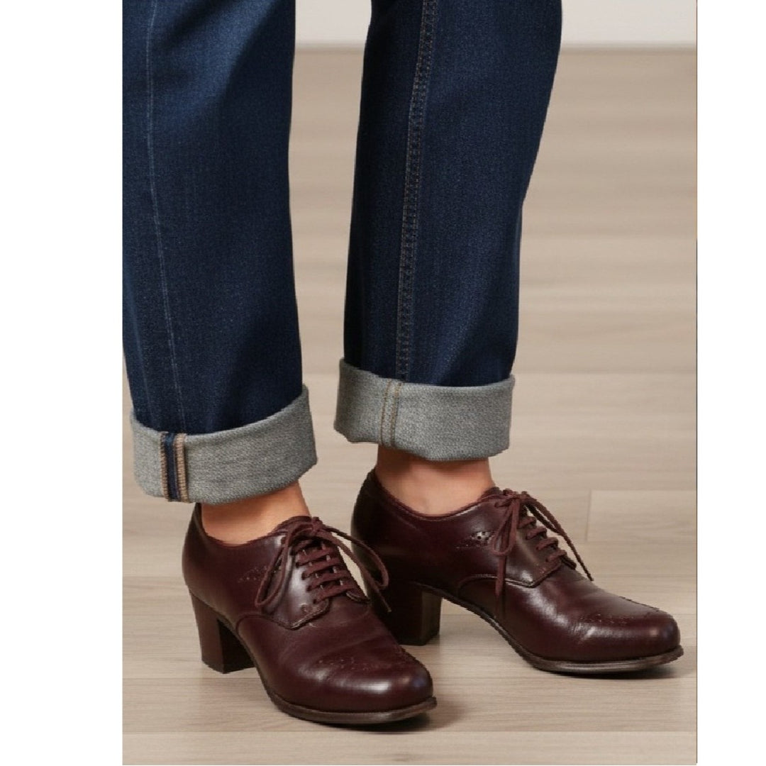 7A Vintage 1940s Women's Heeled Kid Leather Ghillie Oxfords, WW2 era worn with rolled-up jeans on a light wooden floor.
