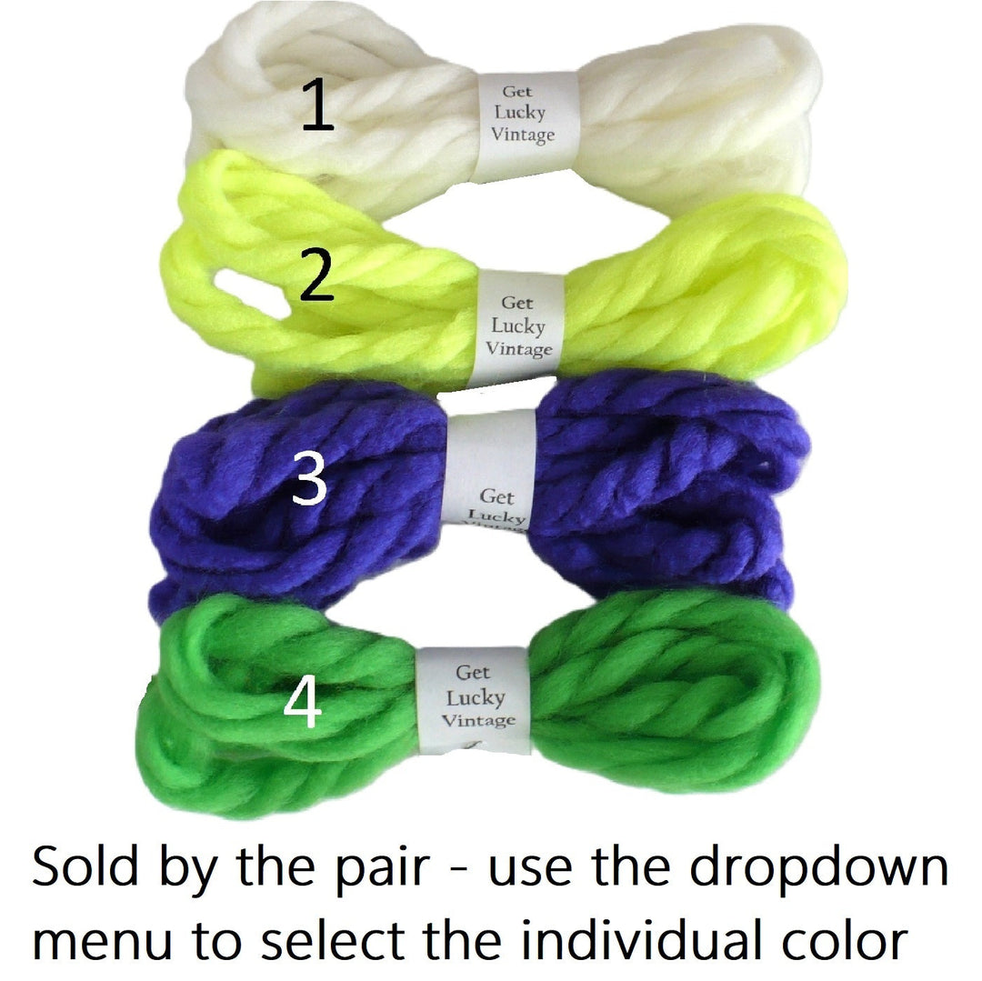 Four pair enumerated vintage yarn hair ties  1 through 4 and text at the bottom stating 'Sold by the pair - use the dropdown menu to select the individual color'.
