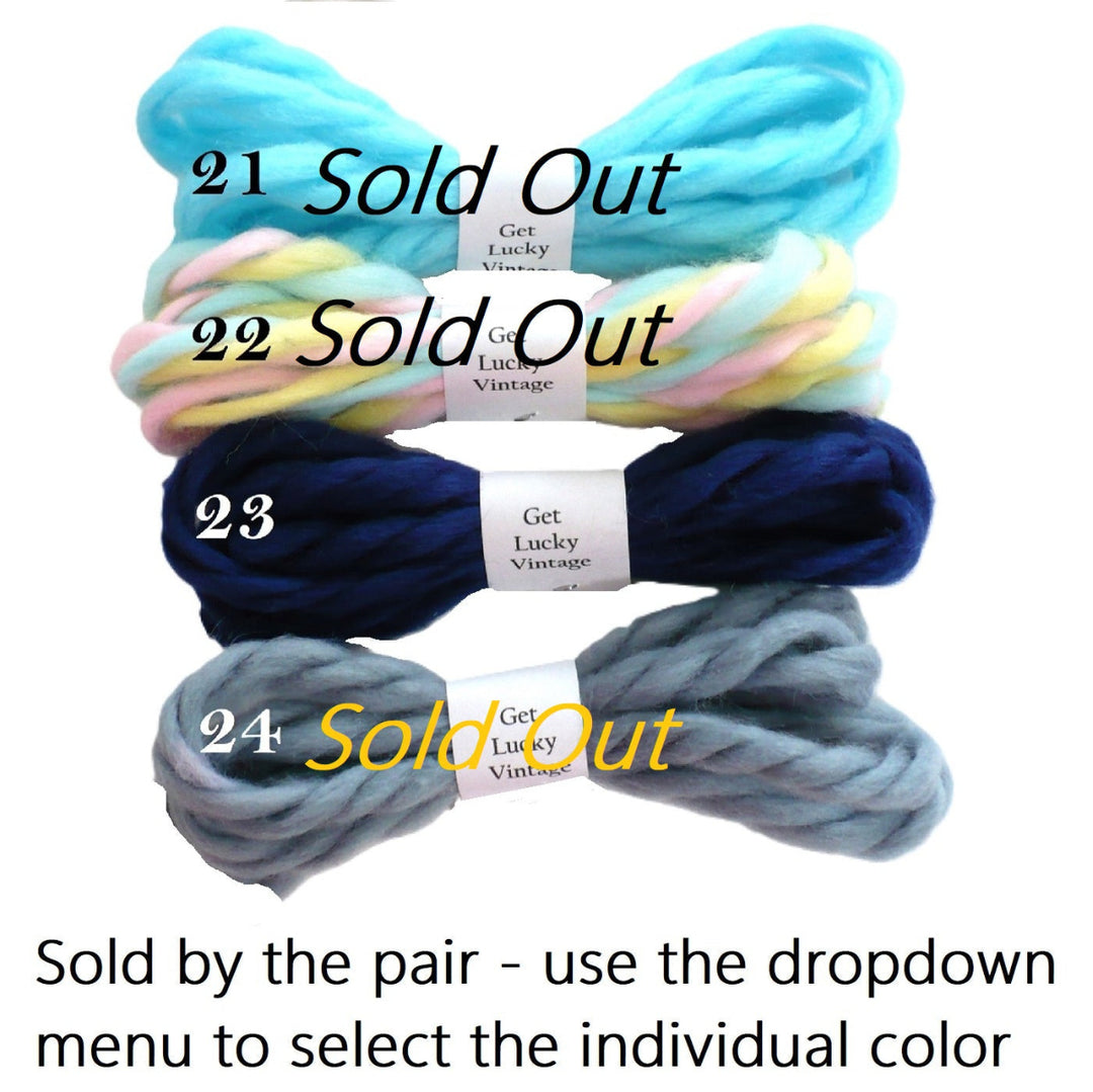 Four pair enumerated vintage yarn hair ties  21 through 24 and text at the bottom stating 'Sold by the pair - use the dropdown menu to select the individual color'.