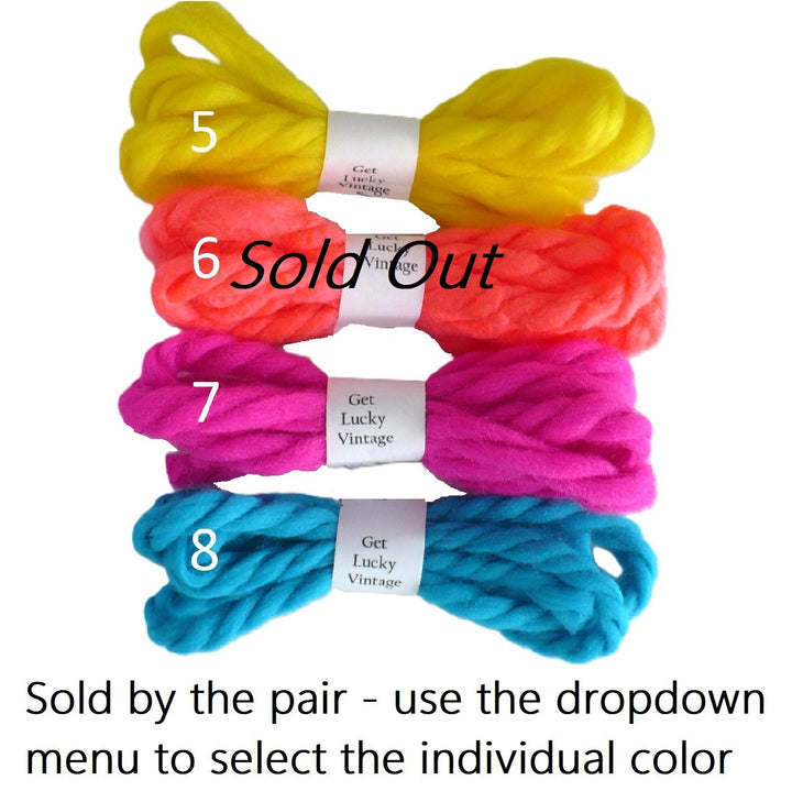 Four pair enumerated vintage yarn hair ties 5 through 8 and text at the bottom stating 'Sold by the pair - use the dropdown menu to select the individual color'.