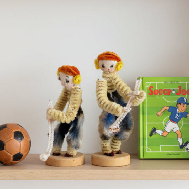 1950s Japan Pipe Cleaner Golfer Dolls – Vintage Chenille Bendy Dolls on shelf.