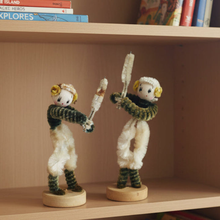 1950s Japan Pipe Cleaner Baseball or Cricket Dolls – Vintage Sports Bendy Dolls. on a bookshelf with books.