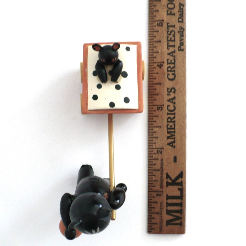 Black cat toy figurine.