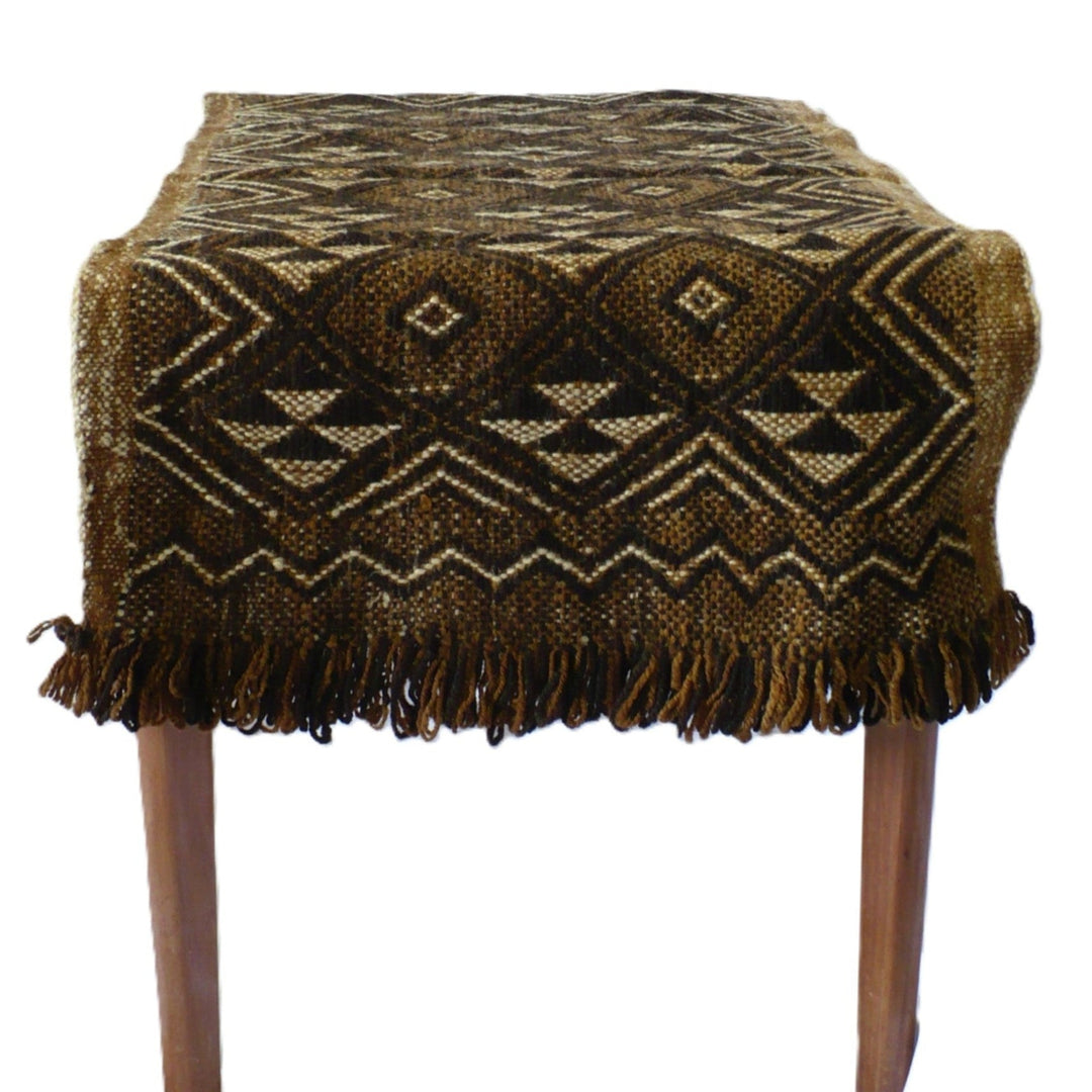Underside of 1950s Handwoven Mapuche Accent Rug or Runner (37-inches) - Argentina on a table.
