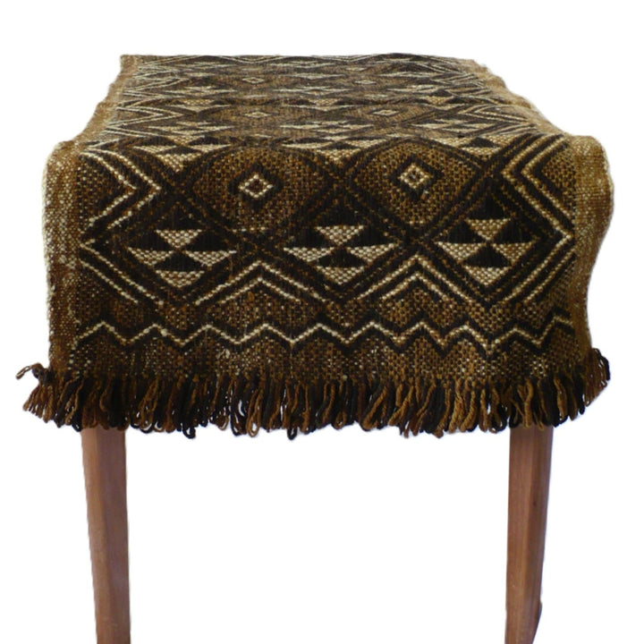 Underside of 1950s Handwoven Mapuche Accent Rug or Runner (37-inches) - Argentina on a table.