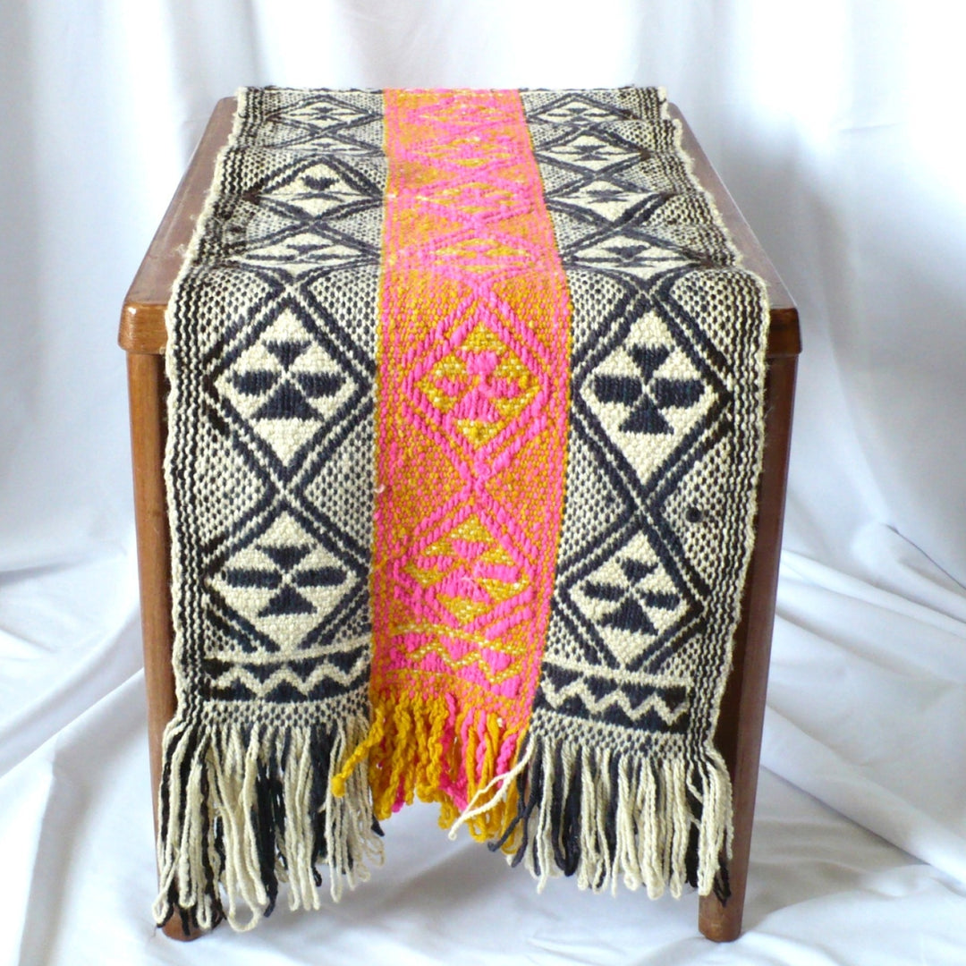 1960s Handwoven Mapuche Table Runner draped on a table.