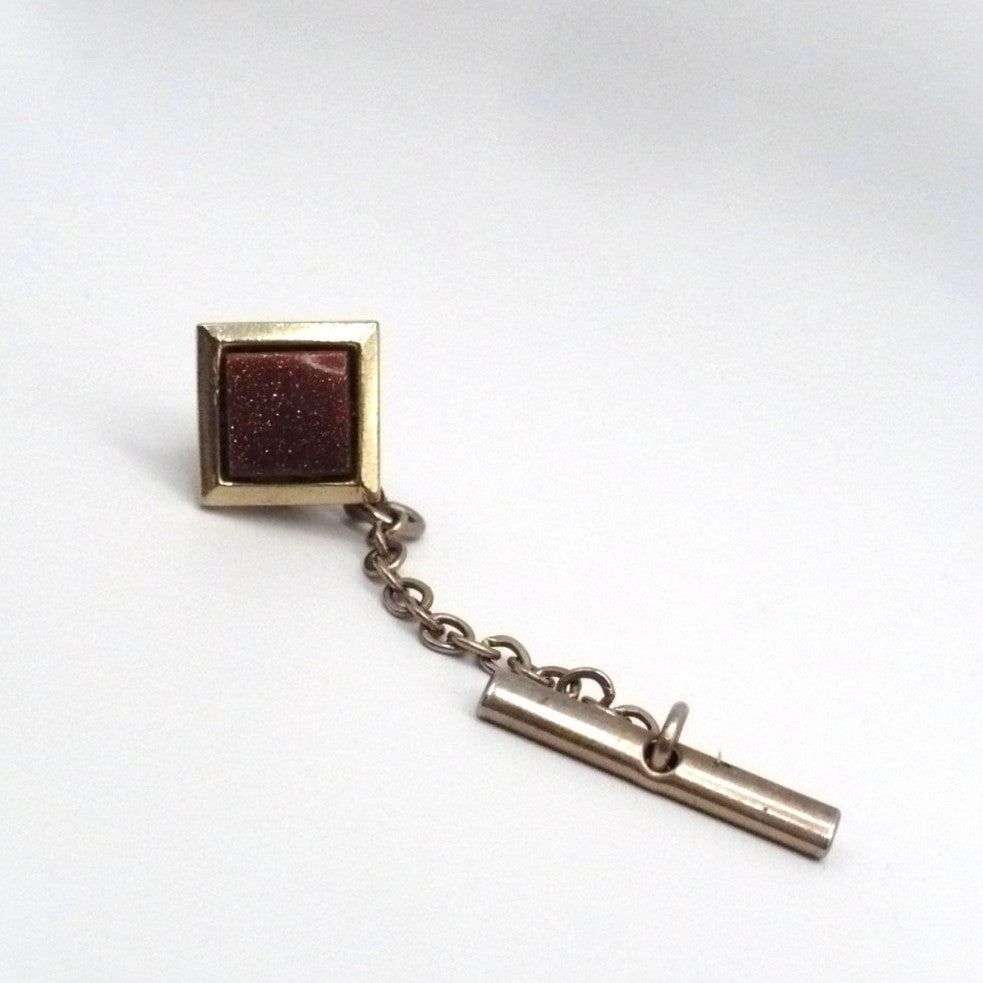 Vintage goldstone old tie tack with chain and bar.