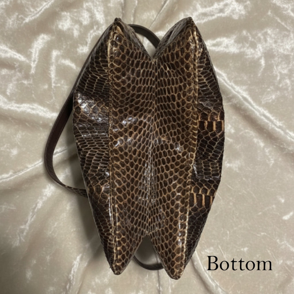 bottom view of expandable python handbag.