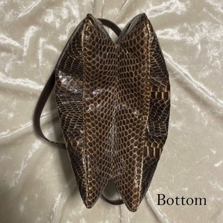 bottom view of expandable python handbag.