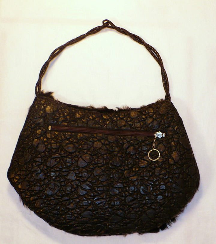 Black fur muff, back view.