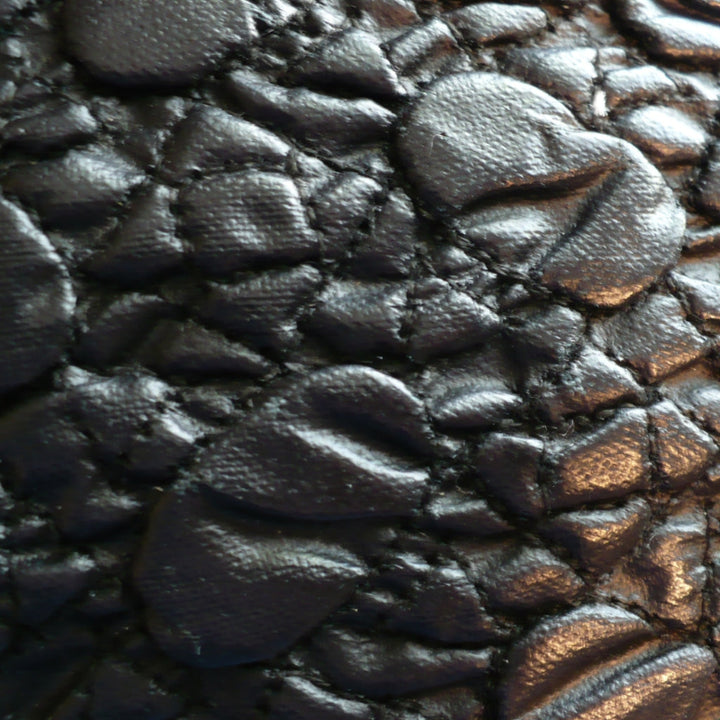Close-up of pebbled reverse.