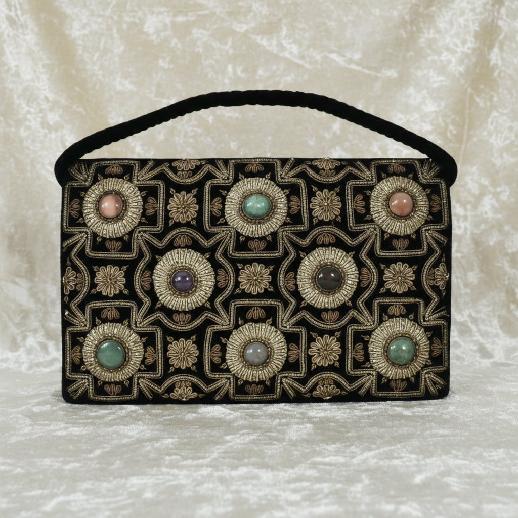 1940s Vintage Black Velvet Anglo-Indian Genuine Gemstone Handbag, front view, creamy velvet background.