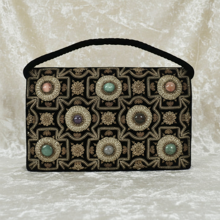 1940s Vintage Black Velvet Anglo-Indian Genuine Gemstone Handbag, front view, creamy velvet background.