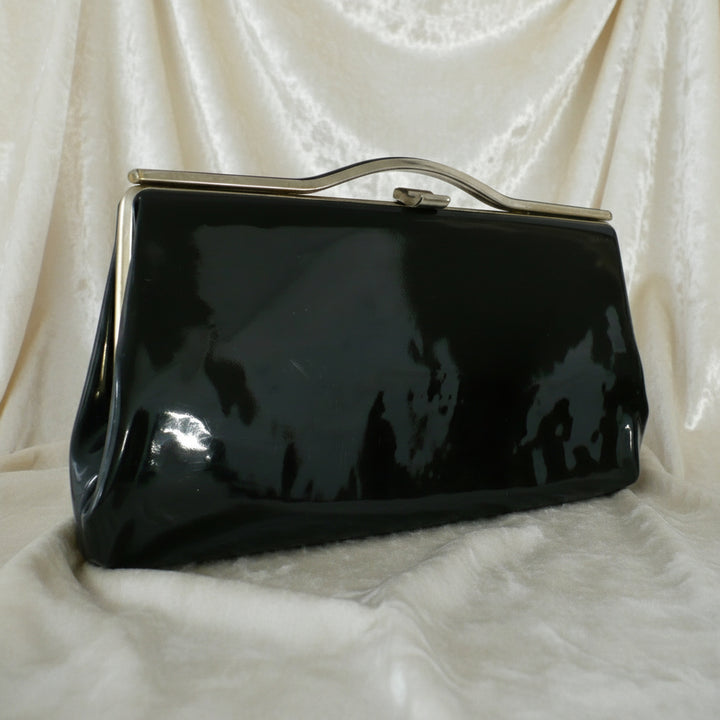 1964 Vintage Black Patent-look Cutout Handle Long Slender Handbag.
