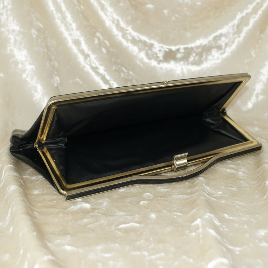 1964 Vintage Black Patent-look Cutout Handle Long Slender Handbag.