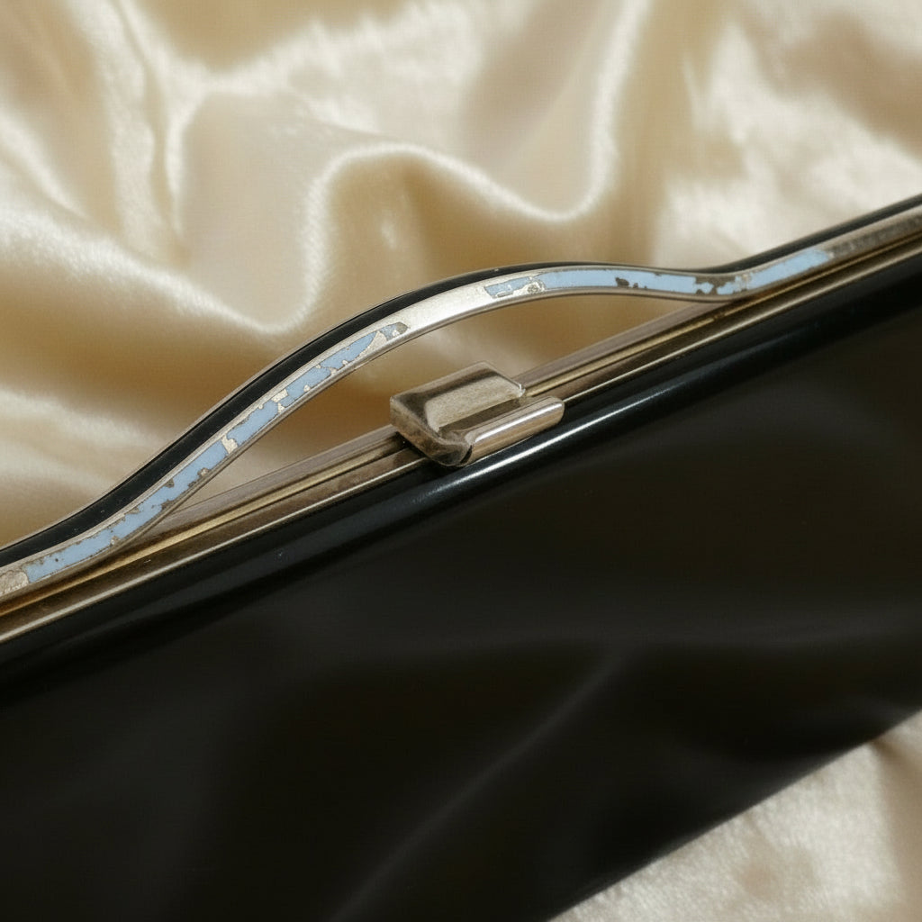 1964 Vintage Black Patent-look Cutout Handle Long Slender Handbag.