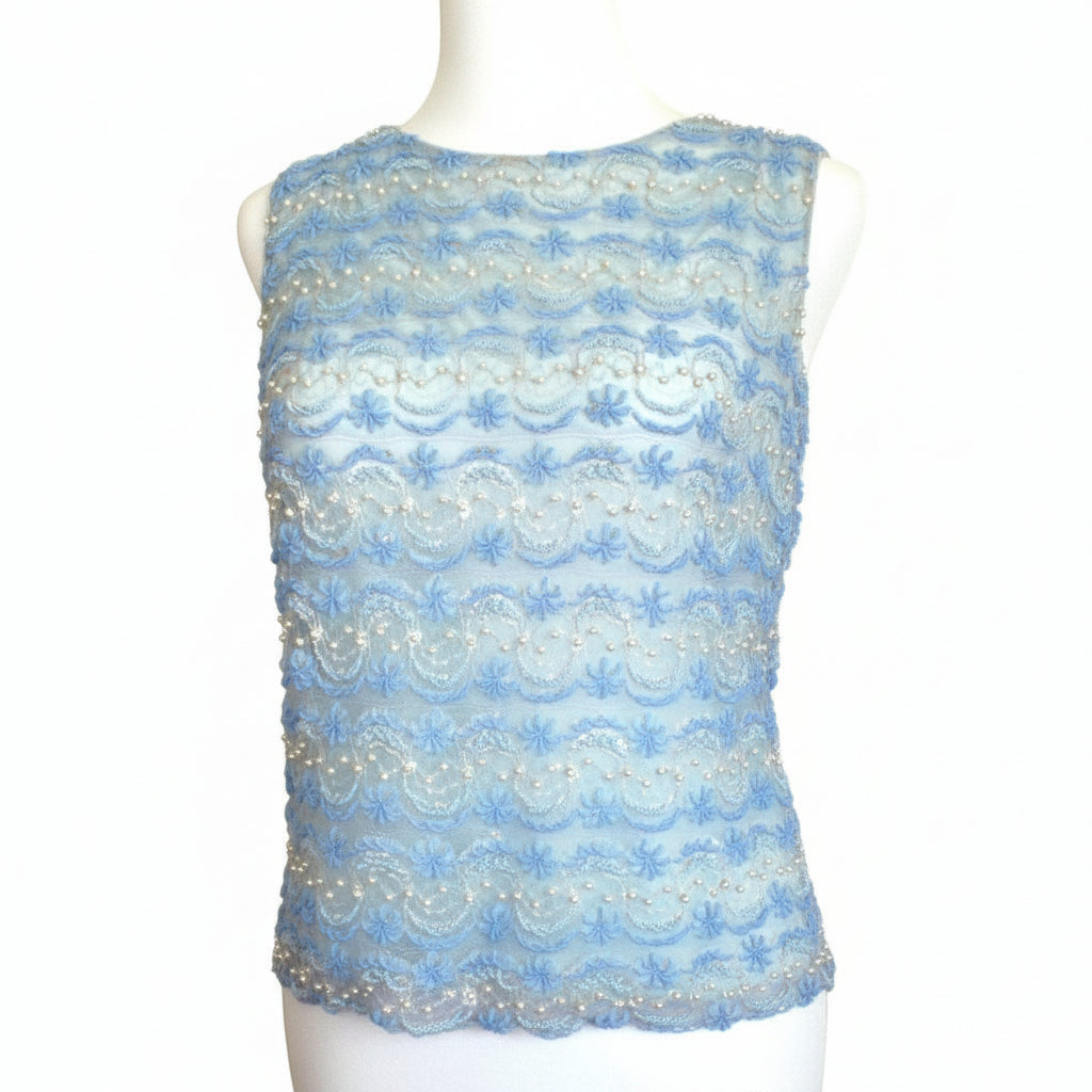 Small 1960s Vintage Periwinkle Blue Beaded Shell Cocktail Top Shirt on a dress form with plain background.