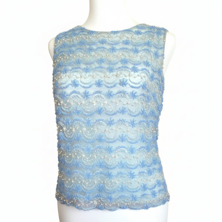 Small 1960s Vintage Periwinkle Blue Beaded Shell Cocktail Top Shirt on a dress form with plain background.