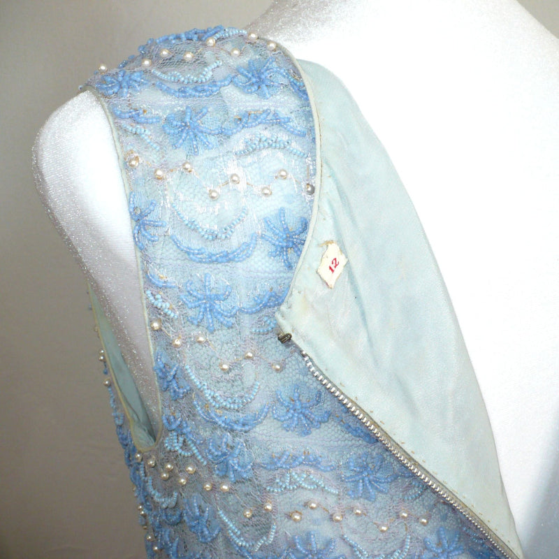 Small 1960s Vintage Periwinkle Blue Beaded Shell Cocktail Top Shirt , back unzipped to reveal lining and label.