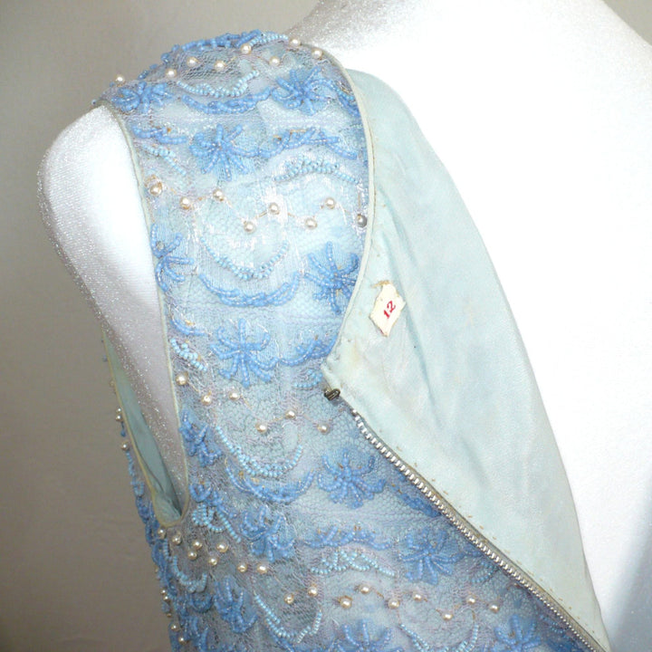 Small 1960s Vintage Periwinkle Blue Beaded Shell Cocktail Top Shirt , back unzipped to reveal lining and label.