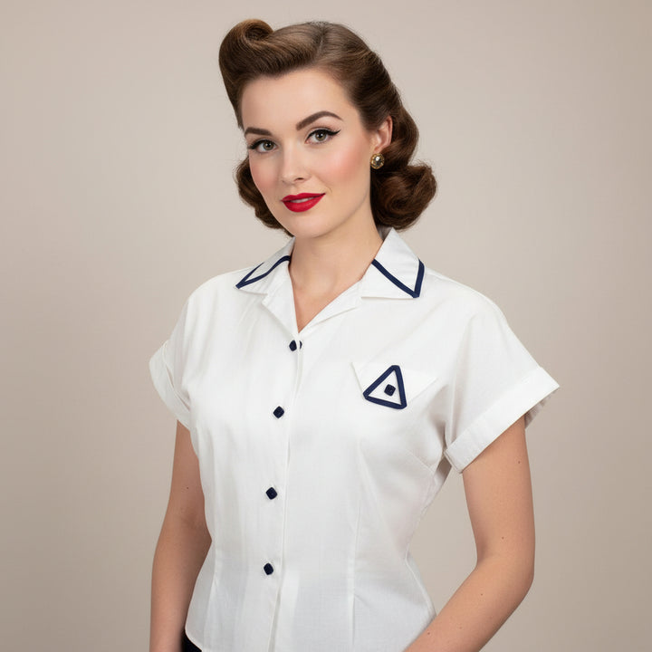 1940 1950 Vintage White Cotton Summer Blouse Navy Trim Nipped Waist on model with plain background.