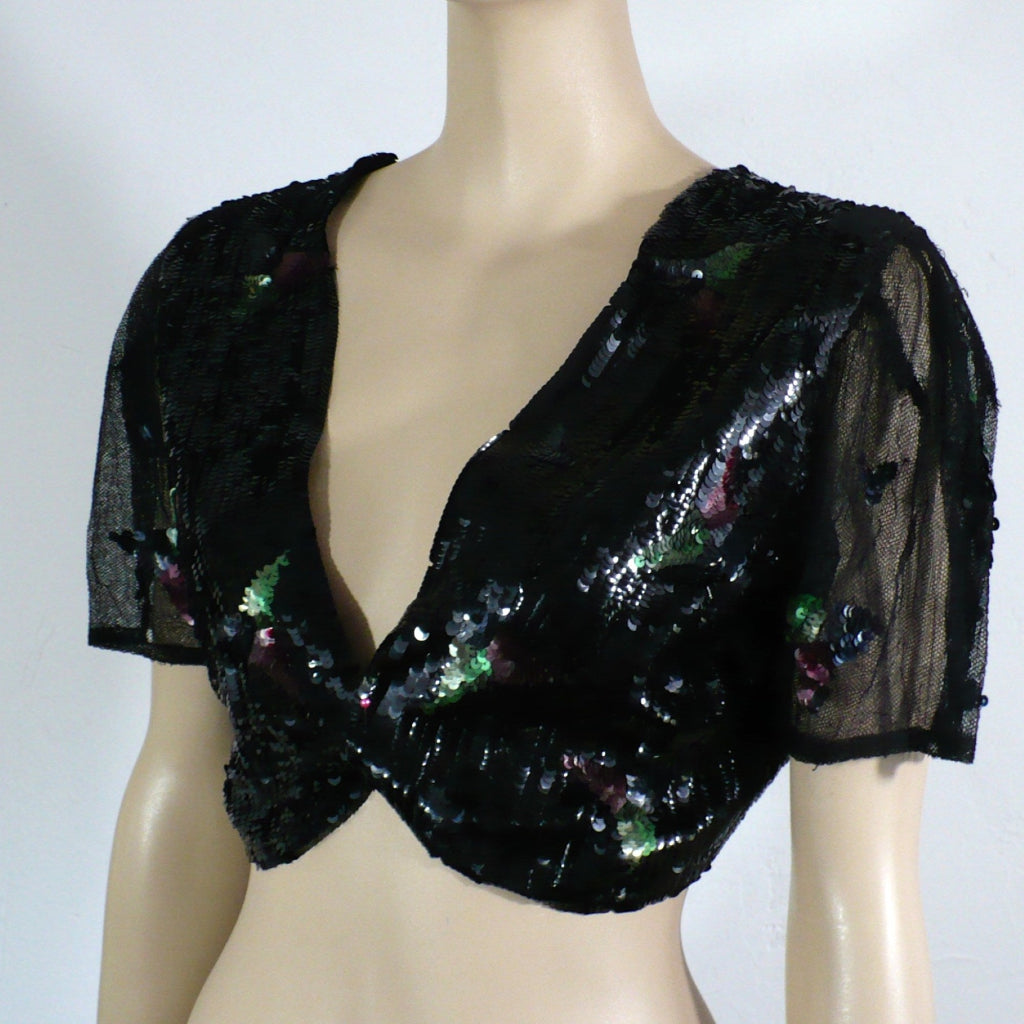 1930s vintage Old Hollywood Glamour gelatin sequins evening bolero faceing left.