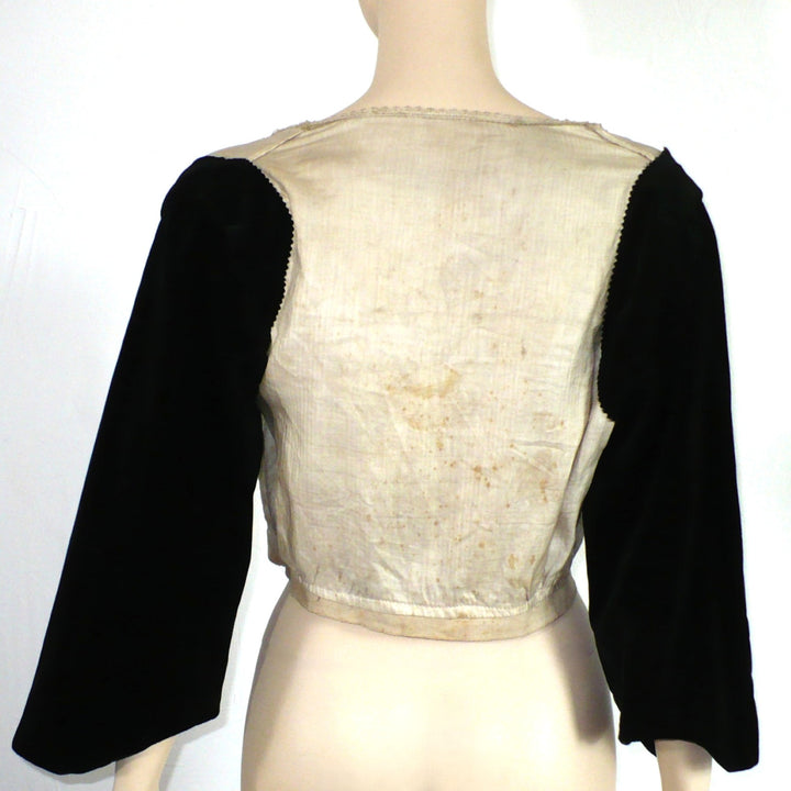 Back view 1890s Aesthetic Reform Dress Foundation Bodice Blouse on mannequin with plain background.