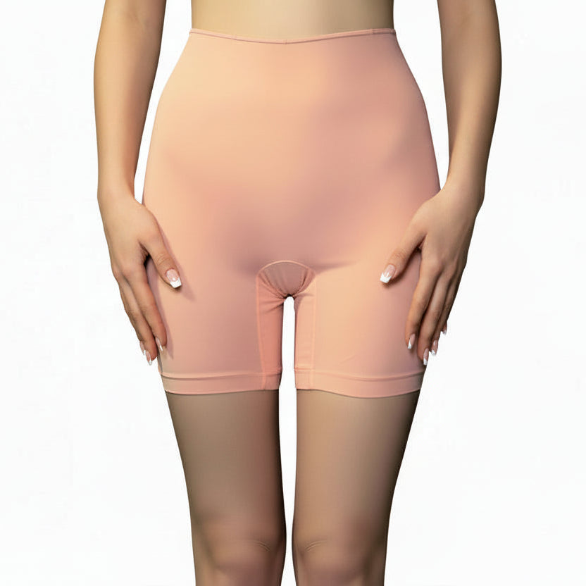 Woman wearing peach-colored long leg panties on a white background
